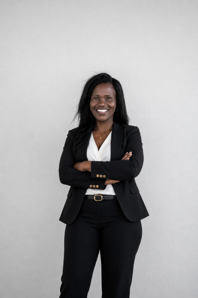 Pindi, property agent at Green Valley Estate, smiling in professional portrait